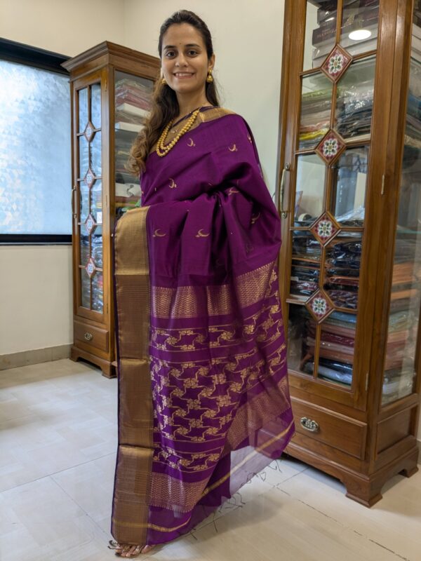 Full front view of festive magenta silk-cotton Maheshwari saree with traditional motifs and rich handwoven finish.