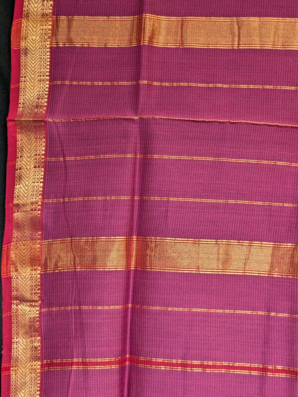Detailed image of zari-lined pallu with delicate golden stripes and understated traditional charm.