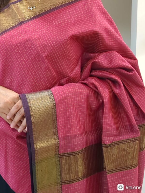 Close-up of onion pink Maheshwari silk-cotton saree with zari checks, medium border