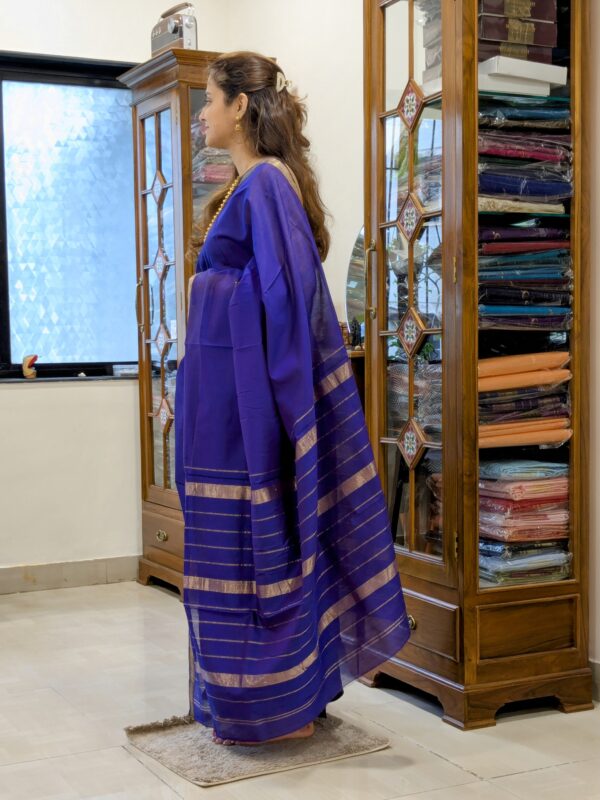 Side view of violet saree highlighting soft drape, silk-cotton blend, and refined weave.